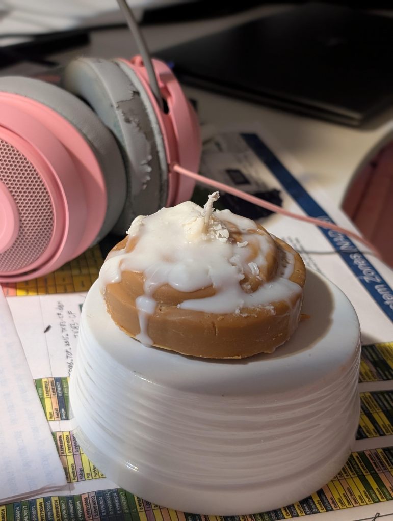 cinnamon roll candle with frosting